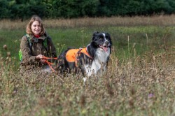 Annegret Grimm-Seyfarth with specially trained detection dog 